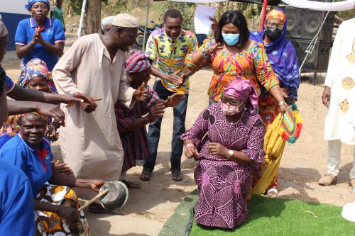 Regional Minister dancing with community members 