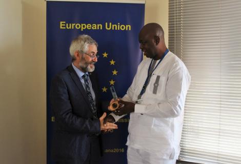 Sumaila Abdul-Rahman, Country Director of ActionAid Ghana receives the Overall Award for Video Most Appealing to the European Public from Paolo Salivia, the Chargé d’Affaires of the European Union in Ghana