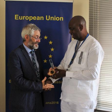 Sumaila Abdul-Rahman, Country Director of ActionAid Ghana receives the Overall Award for Video Most Appealing to the European Public from Paolo Salivia, the Chargé d’Affaires of the European Union in Ghana