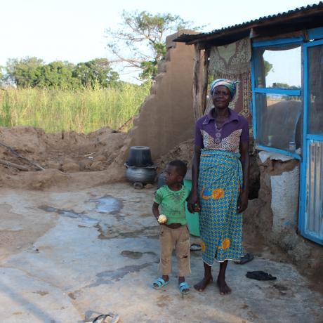 Kanpege and her son, Daniel lost a portion of their home during torrential rains in the Upper East region